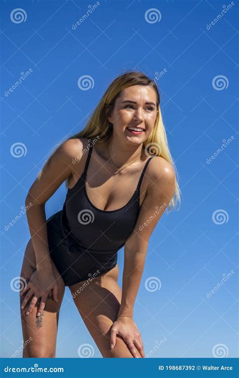 Beautiful Bikini Model Posing In A Beach Environment Stock Photo