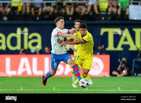 Ilias Akhomach Of Villarreal And Pablo Martin Gavi Of Barcelona