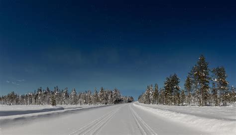 Beautiful northern lights aka aurora borealis and moonlit winter ...