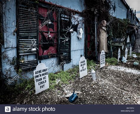 Funny Halloween decorations in front of a haunted house Stock Photo - Alamy