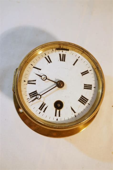 Sold At Auction Small Antique Brass Ships Bulkhead Clock With Enamel Dial 12 Cm Wide