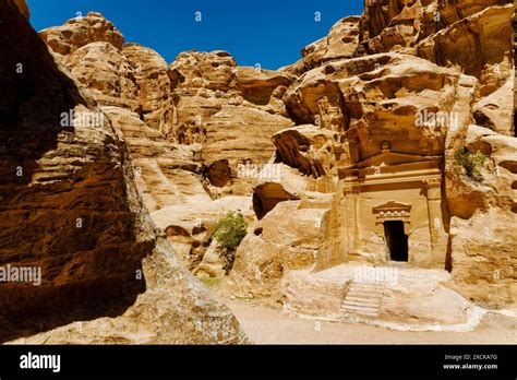 Entrance Of Ancient Building Carved In Rock Wall Petra Jordan Stock
