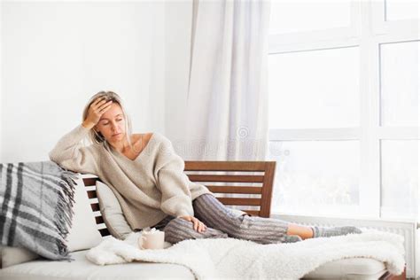 Depressed Lonely Unhappy Mental Woman Sitting Alone On The Sofa Feel