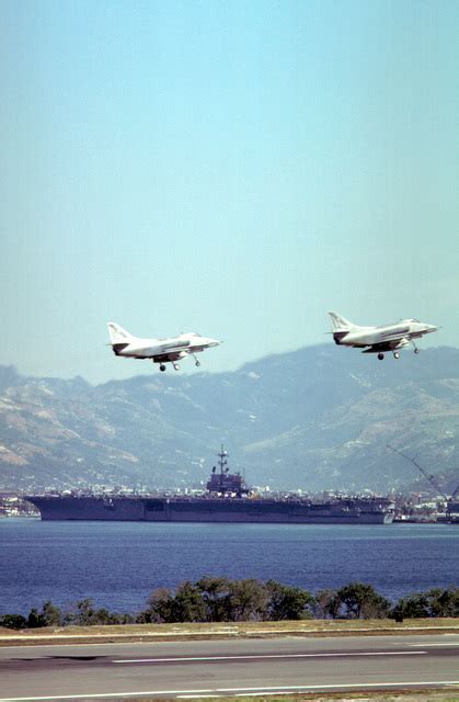 A Skyhawk Aircraft Fly Near The Aircraft Carrier Uss Independence Cv