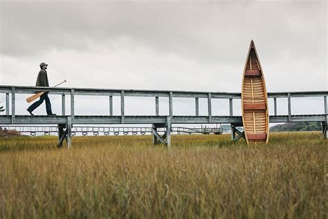 Man With Canoe By Stocksy Contributor Raymond Forbes LLC Stocksy