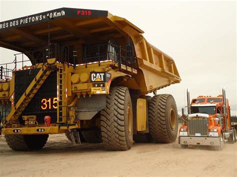 The incredible size of a construction dump truck. (Semi truck for scale ...