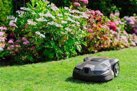 Premium Photo Robotic Lawn Mower On Green Grass