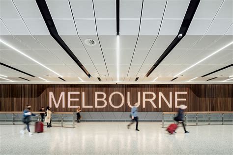 Grimshaw unveils Melbourne airport arrivals hall infused with "local