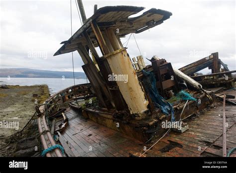 Wrecked Fishing Boats Beached On Shore At Salen Isle Of Mull Stock