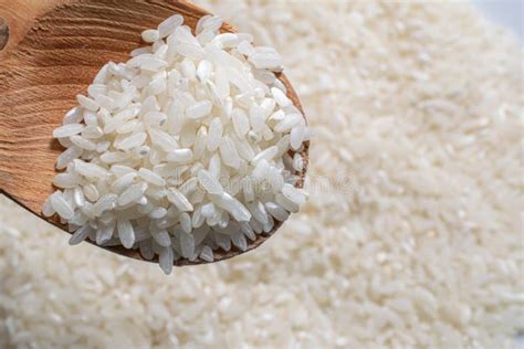 White Husked Rice On A Wooden Spoon Stock Photo Image Of Spoon