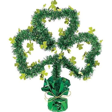 A Green Present Wrapped In Tinsel With Shamrocks On It S Sides And Tied