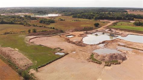 Aerial View Of A Sand Gravel Mine Quarry Full With Water Stock