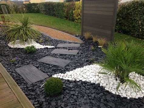 A Garden With Rocks And Plants In It