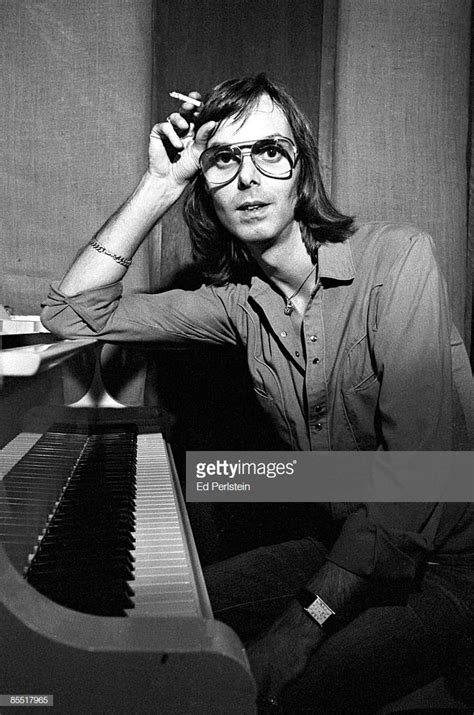 Photo of Nicky HOPKINS; Nicky Hopkins, posed, at piano, holding ...