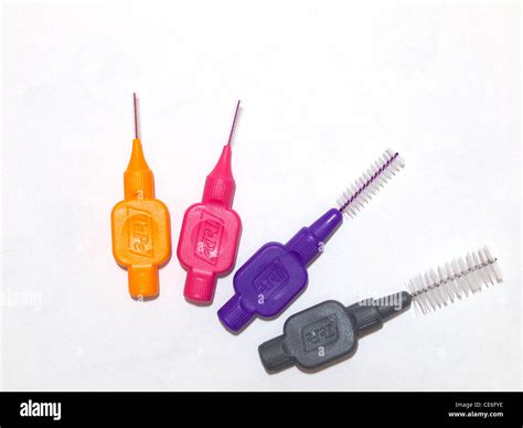 Four Inter Dental Tooth Brushes Of Various Sizes For Cleaning Between