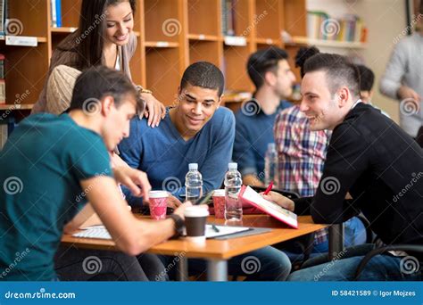 Friends Socializing And Studying Together For Exam Stock Image Image