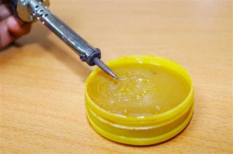 Premium Photo Close Up Of Hand Holding Juice
