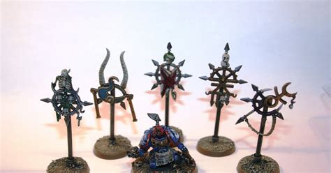 The Warhammers Are All Painted In Different Colors