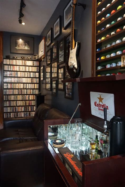 a room filled with lots of bottles and glasses on top of a wooden table ...