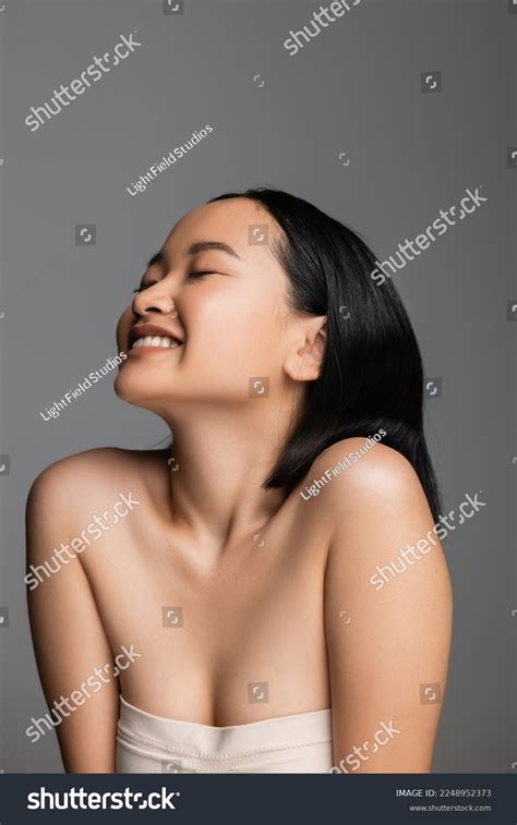 Pleased Asian Woman Naked Shoulders Closed Stock Photo