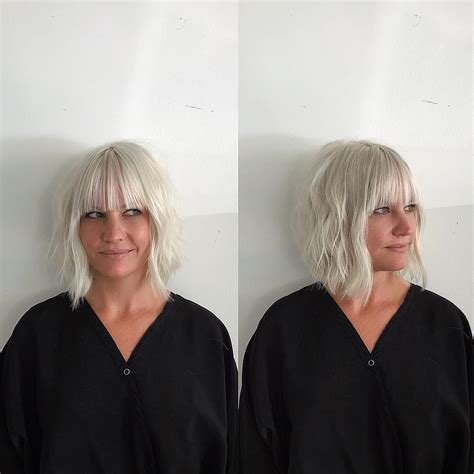 Modern Platinum Angled Bob With Wavy Texture And Bangs The Latest