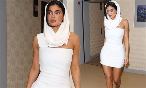 Kylie Jenner Puts On A VERY Leggy Display In A White Hooded Mini Dress