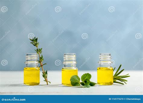 Bottles With Essential Oils And Fresh Herbs Stock Image Image Of