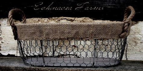 An Old Wire Basket With Rope Hanging From It S Sides On A Wooden Ledge