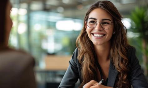 Premium Photo Smiling Female Manager Interviewing An Applicant In Office