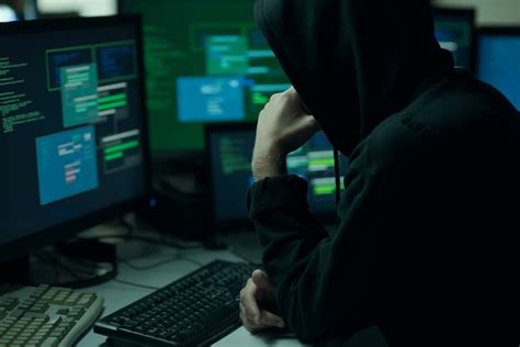 Premium Photo Hacker With Hoodie Working With A Computer