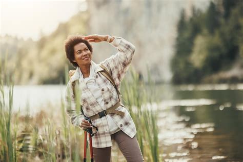 Premium Photo Mature Black Woman With Backpack Enjoying The View Of