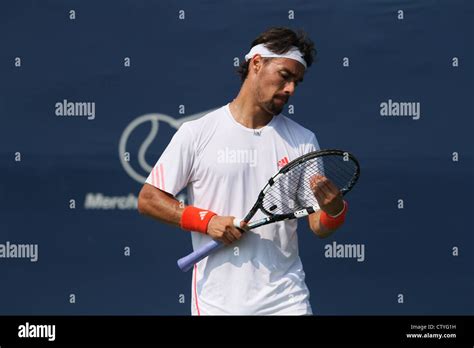 male tennis player fixing racket string tension Stock Photo - Alamy