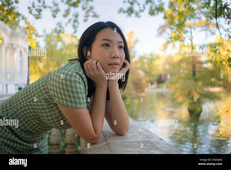 Lifestyle Portrait Of Young Happy And Attractive Asian Chinese Woman