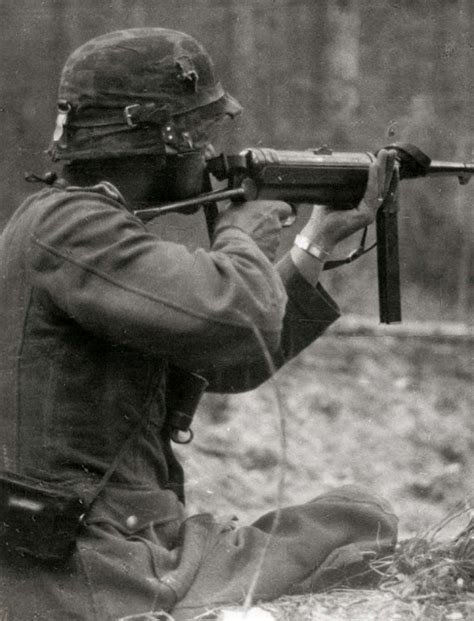 World War II History: A German infantryman aims his MP40 submachine gun on the eastern front, 1941.