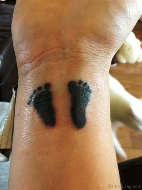 Adorable Baby Footprint Tattoos On Wrist