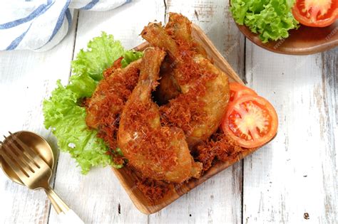 Premium Photo Ayam Goreng Serundeng Fried Chicken Sprinkled With