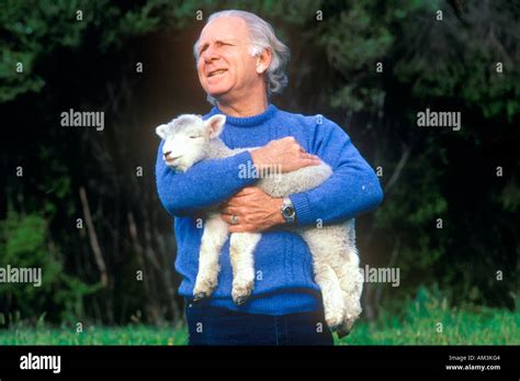 Farmer and lamb New Zealand Stock Photo - Alamy