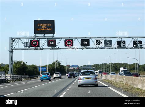 Traffic on the m5 motorway.. A overhead gantry shows congestion ...