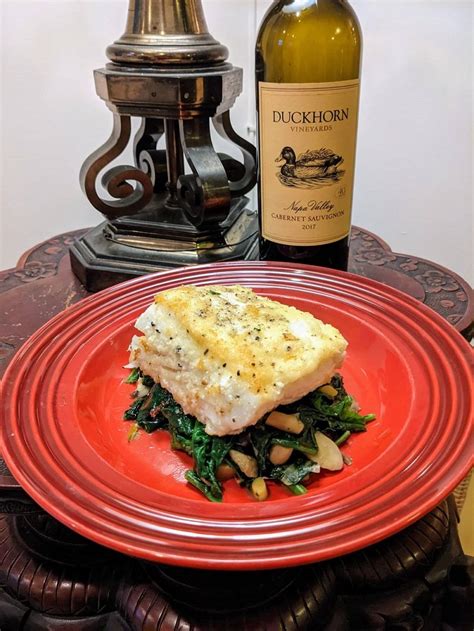 Semolina Crusted Halibut Over Herbed Wild Mushrooms Leeks And Wilted Spinach — Yakobi