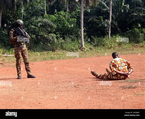 A Côte Ivoire Special Forces Soldier trains on how to guard a prisoner