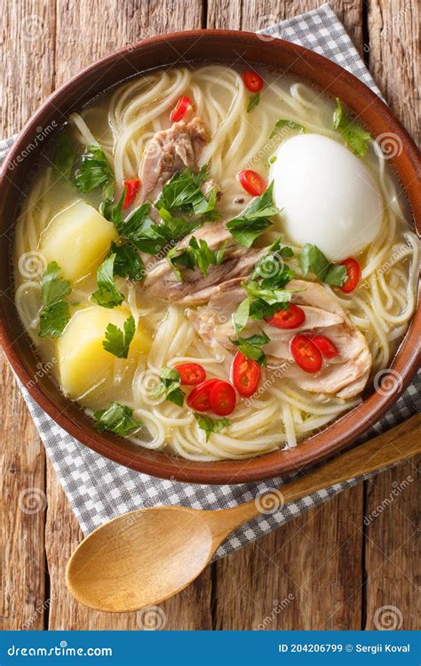 Peruvian Caldo De Gallina Chicken Soup Closeup In The Plate Horizontal