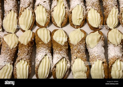 Many Sicilian Cannoli With Sweet Custard For Sale In Bakery Stock Photo