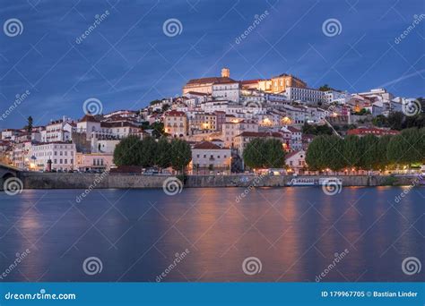 Illuminated Skyline Of City Coimbra With Bridge Ponte Santa Clara At