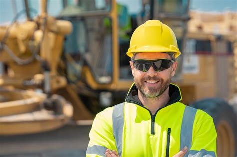 Premium Photo | Construction worker at house under construction builder in building uniform on ...