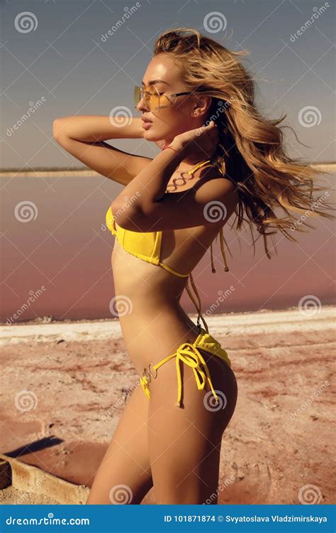 Beautiful Girl With Blond Hair In Elegant Swimsuit Posing Near R Stock