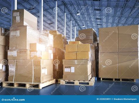 Stacked Of Package Boxes On Pallet Rack And Forklift Pallet Jack