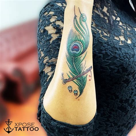 Peacock Feather Tattoos On Arm