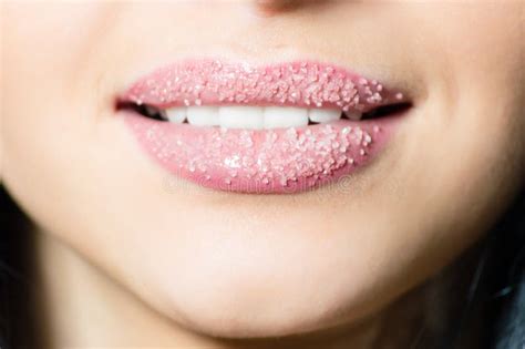 Closeup On Lips Of Young Woman In Sugar Pleasantly Softly Smiling White