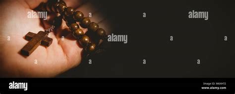 Hand Holding Rosary Beads Stock Photo Alamy