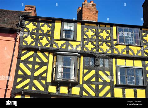 A Yellow Tudor Style Half Timbered Building In Ludlow And English